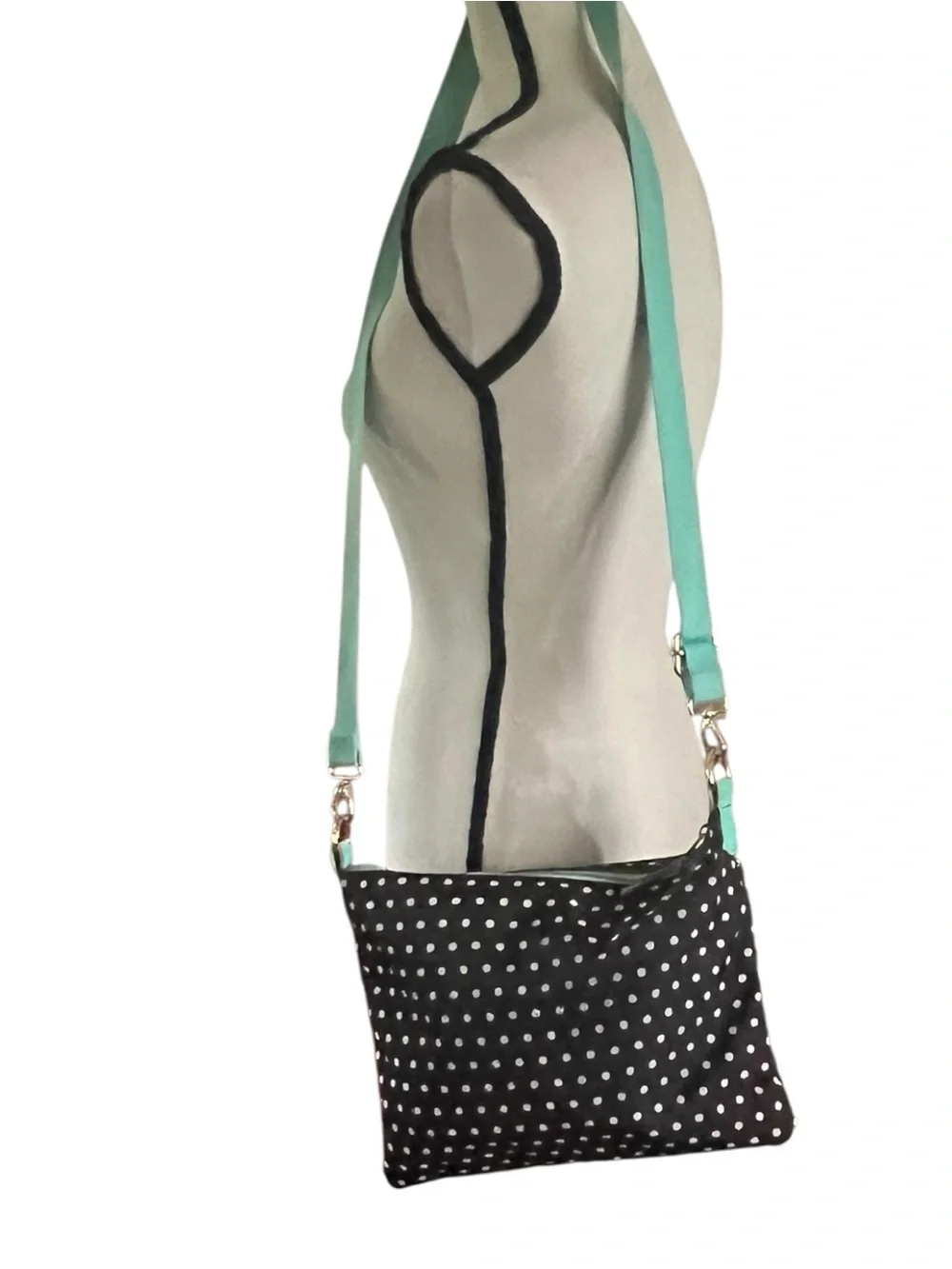 Fossil Keyper polka dot crossbody with mint aqua adjustable strap.